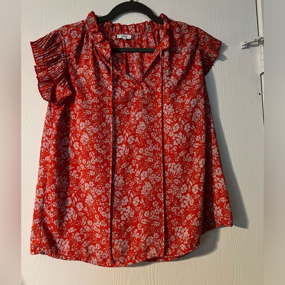 Orange blouse with white detailing